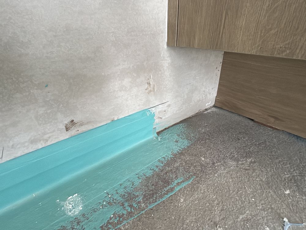 Wet area waterproofing still unfinished when the fixing trades arrived, found during a waterproofing inspection in Beveridge