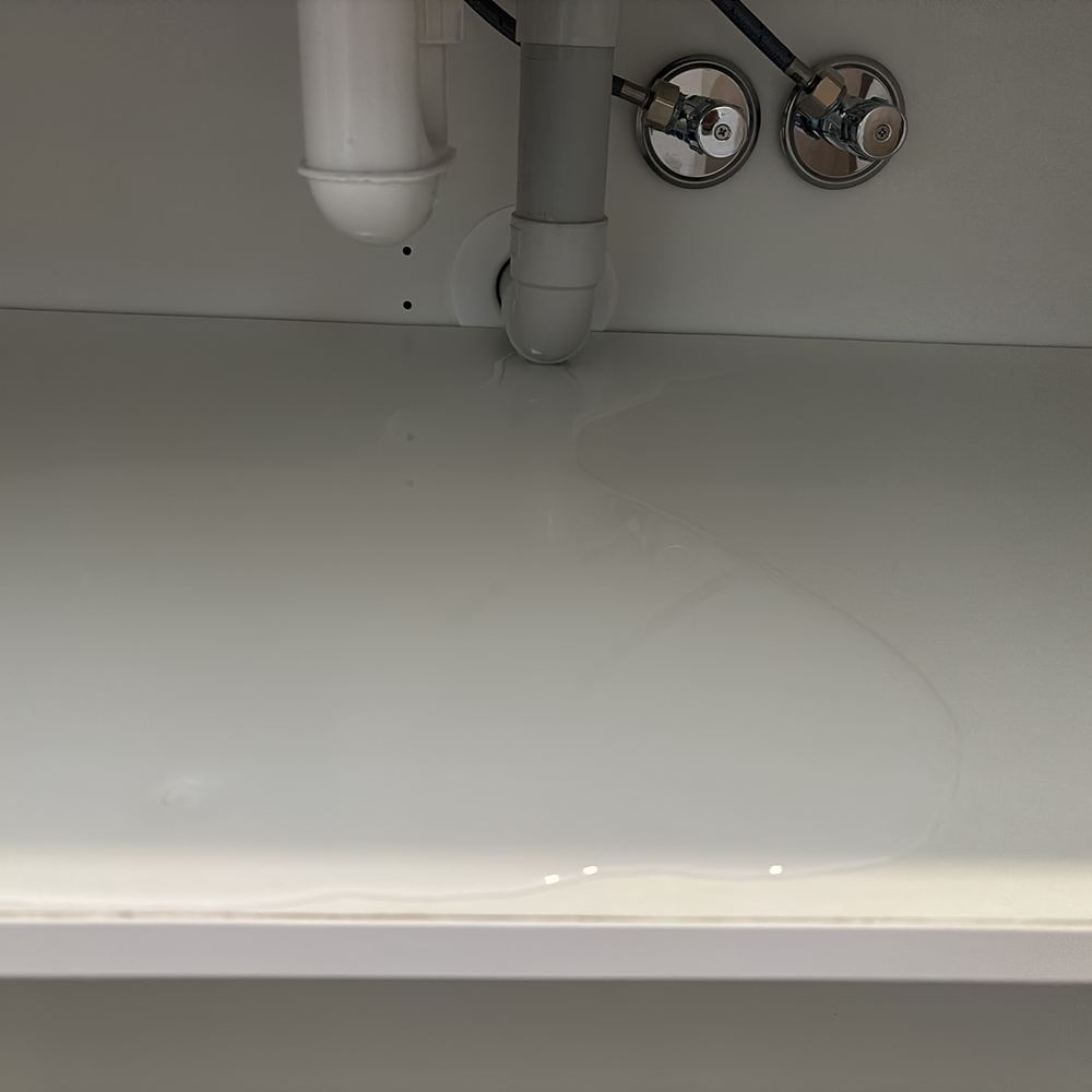 Mixer tap leaking at practical completion, with water reaching the cabinet, found during a pre-handover (PCI) inspection in Beveridge