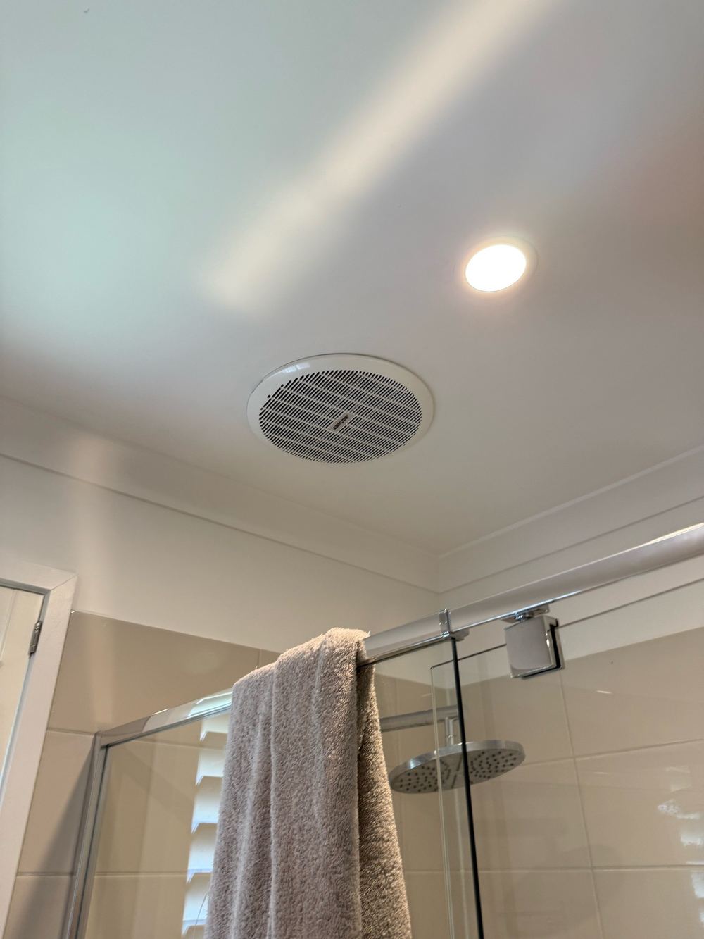 Bathroom fans venting straight into the roof void instead of outside, found during a pre-purchase inspection in Doreen